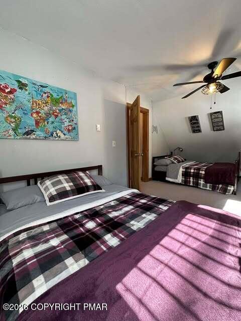 4309 Winchester Way Bushkill, PA 18324 - Photo 14 of 56 a bedroom with furniture and flat screen tv