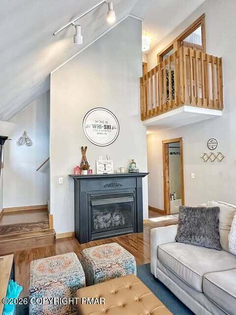 4309 Winchester Way Bushkill, PA 18324 - Photo 28 of 56 a living room with furniture a fireplace and wall paintings