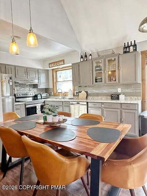4309 Winchester Way Bushkill, PA 18324 - Photo 29 of 56 a kitchen with a table chairs and microwave