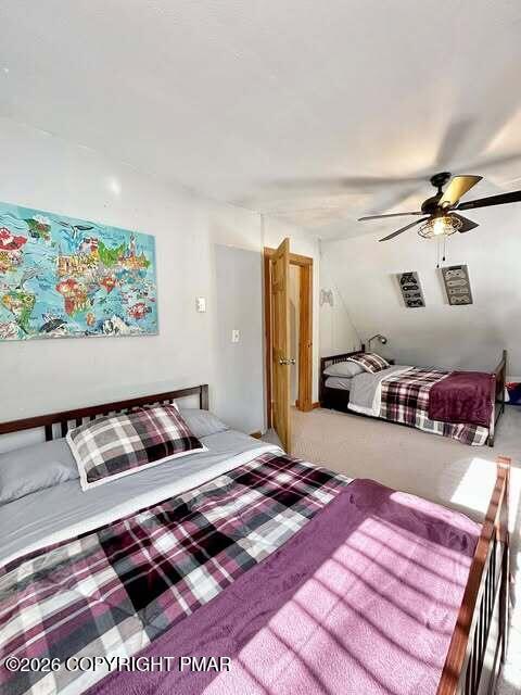 4309 Winchester Way Bushkill, PA 18324 - Photo 32 of 56 a bedroom with a bed and wooden floor