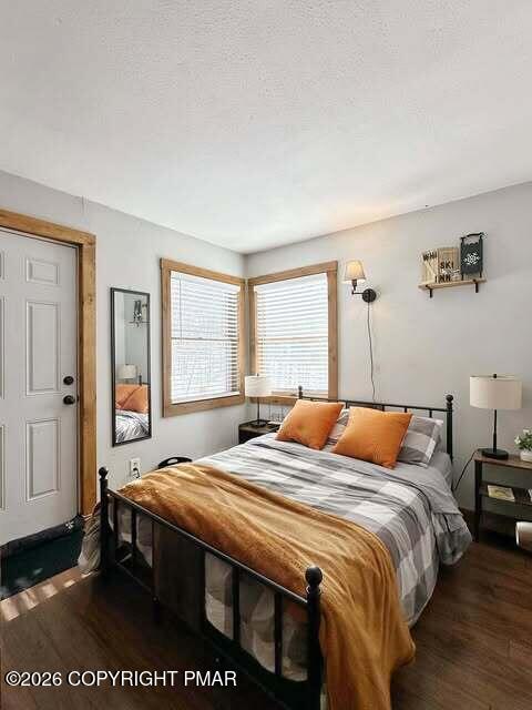 4309 Winchester Way Bushkill, PA 18324 - Photo 39 of 56 a bedroom with a bed a table and chair