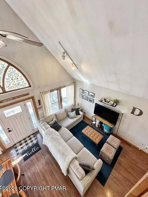 4309 Winchester Way Bushkill, PA 18324 - Photo 41 of 56 a living room with couches and a fireplace with wooden floor