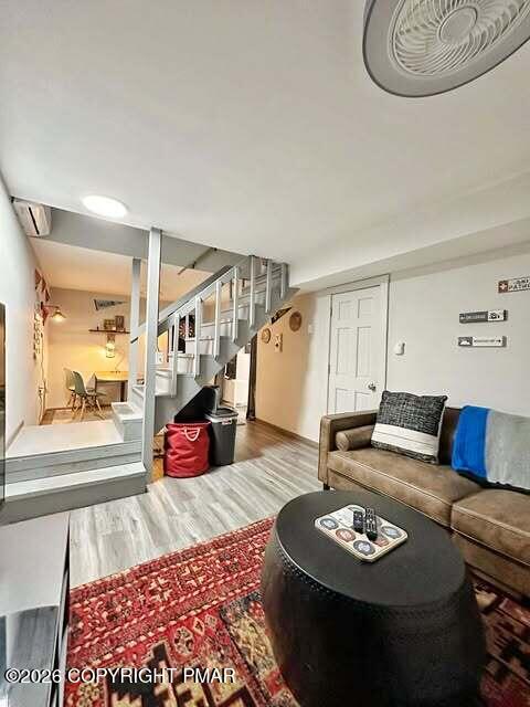 4309 Winchester Way Bushkill, PA 18324 - Photo 43 of 56 a living room with furniture and a wooden floor