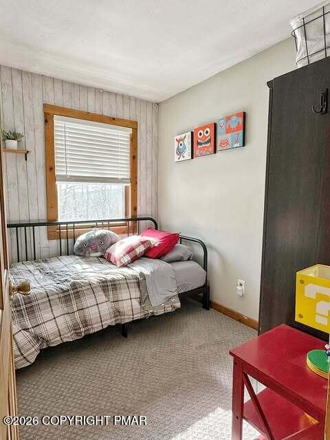 4309 Winchester Way Bushkill, PA 18324 - Photo 44 of 56 a bedroom with a bed and a table in it