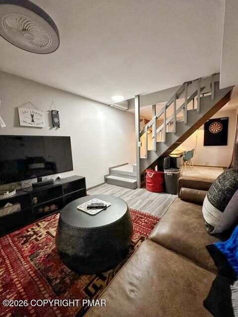 4309 Winchester Way Bushkill, PA 18324 - Photo 45 of 56 a living room with furniture and a flat screen tv