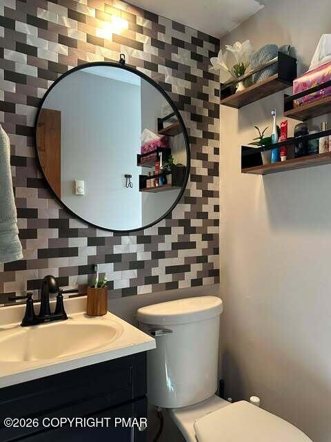 4309 Winchester Way Bushkill, PA 18324 - Photo 46 of 56 a bathroom with a sink a mirror and toilet