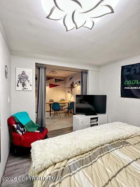 4309 Winchester Way Bushkill, PA 18324 - Photo 5 of 56 a bedroom with a bed and a flat screen tv