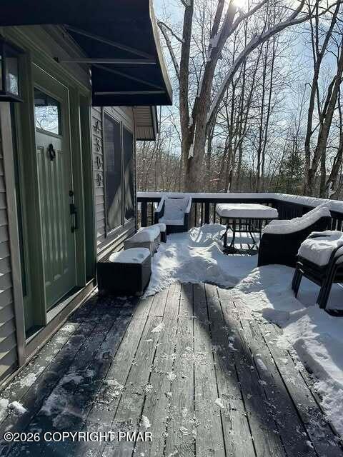 4309 Winchester Way Bushkill, PA 18324 - Photo 56 of 56 a view of a patio with couple of chairs and a fire pit