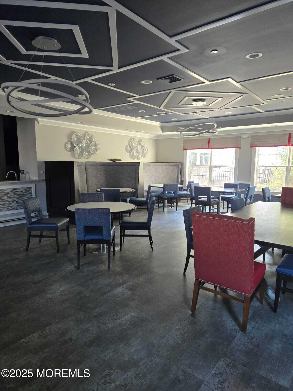 28 Radford Court, Unit 28211 Monroe Township, NJ 08831 - Photo 28 of 33 a view of a big room with dining table and chairs