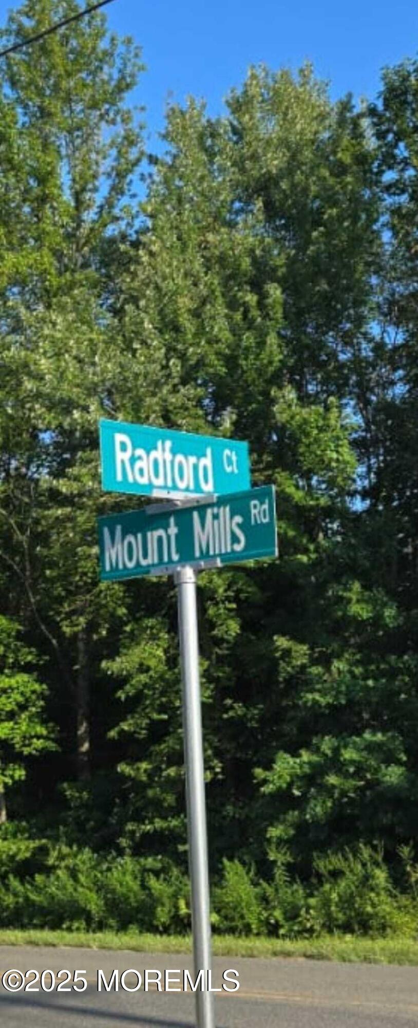28 Radford Court, Unit 28211 Monroe Township, NJ 08831 - Photo 3 of 33 a sign that is sitting on a pole