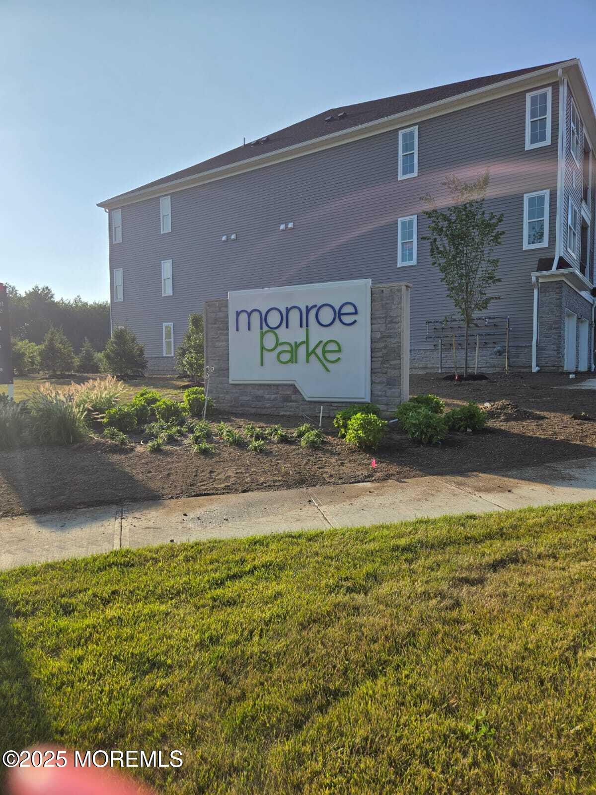 28 Radford Court, Unit 28211 Monroe Township, NJ 08831 - Photo 6 of 33 a view of a brick house with a yard
