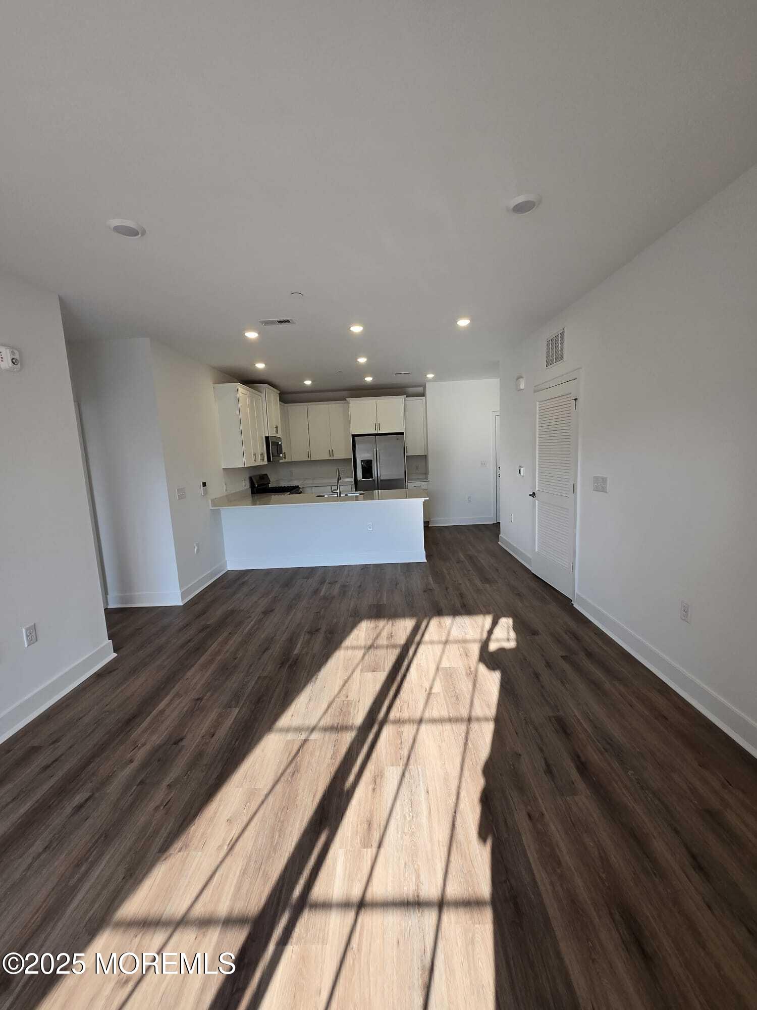 28 Radford Court, Unit 28211 Monroe Township, NJ 08831 - Photo 8 of 33 a view of kitchen with wooden floor