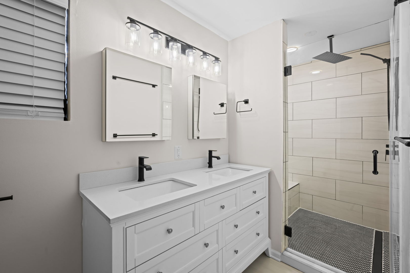 2710 West Haddon Avenue, Unit 2 Chicago, IL 60622 - Photo 8 of 11 a bathroom with a double vanity sink mirror and shower