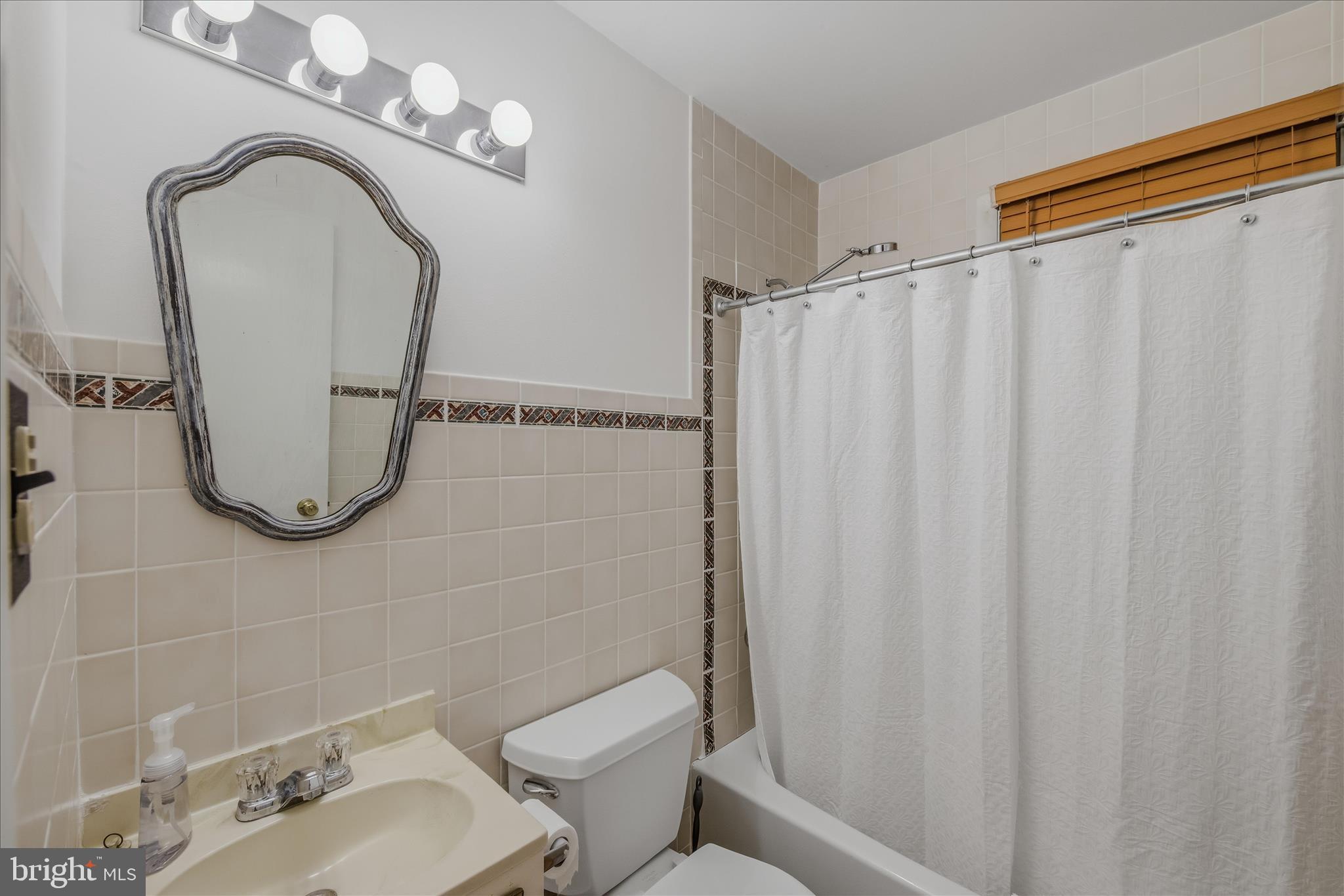 98 Ore Trail Berkeley Springs, WV 25411 - Photo 24 of 46 a bathroom with a sink mirror and toilet
