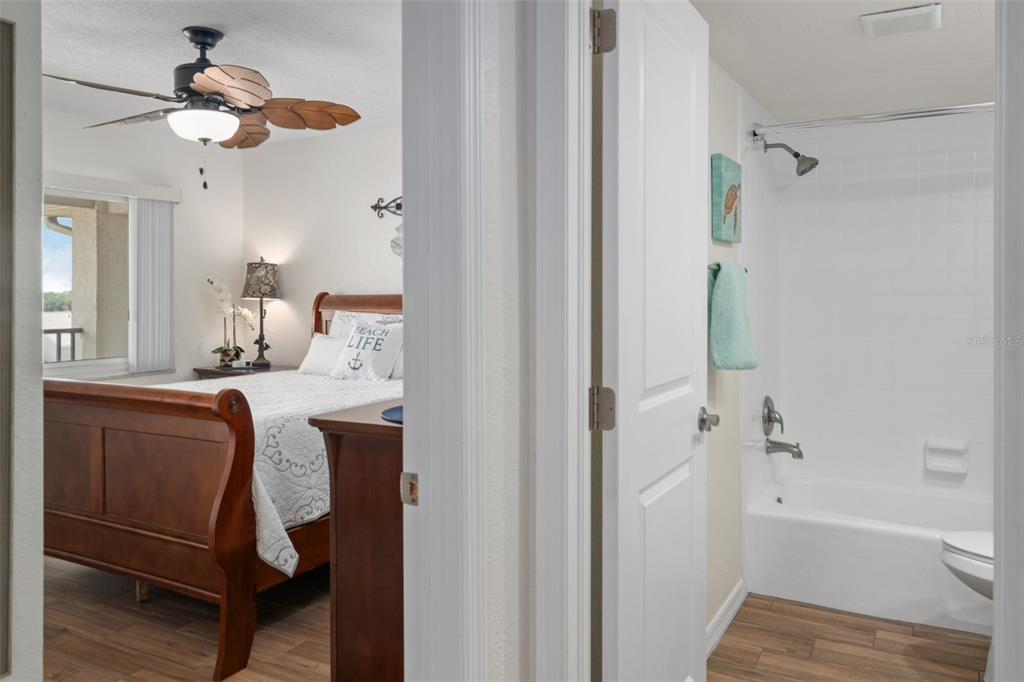 8211 Brent Street, Unit 847 Port Richey, FL 34668 - Photo 17 of 29 a bathroom with a tub shower and a mirror