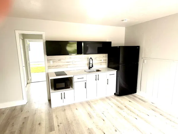 a kitchen with a stove and a refrigerator