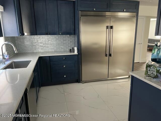 123 Brighton Avenue Deal, NJ 07723 - Photo 3 of 11 a kitchen with a refrigerator and a sink