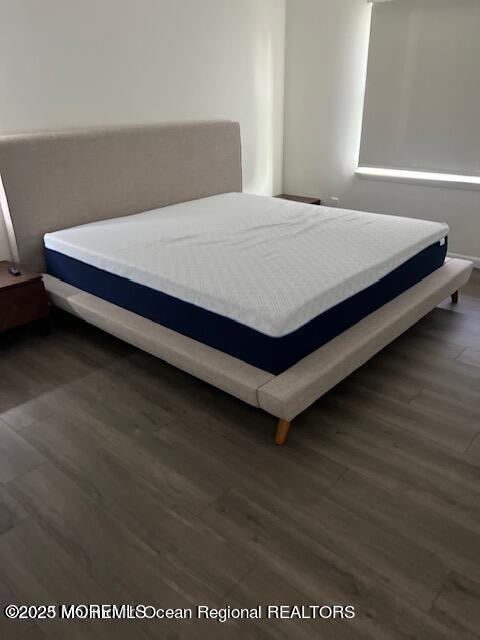 123 Brighton Avenue Deal, NJ 07723 - Photo 5 of 11 a bed sitting in a bedroom next to a window