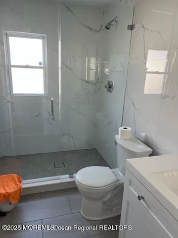 a toilet sitting next to a bathroom sink