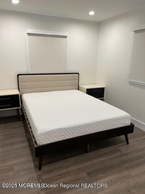 123 Brighton Avenue Deal, NJ 07723 - Photo 9 of 11 a bed sitting in a bedroom next to a window