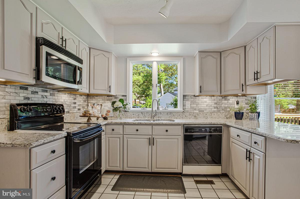7887 Poplar Grove Road Severn, MD 21144 - Photo 12 of 49 Kitchen features granite countertops!