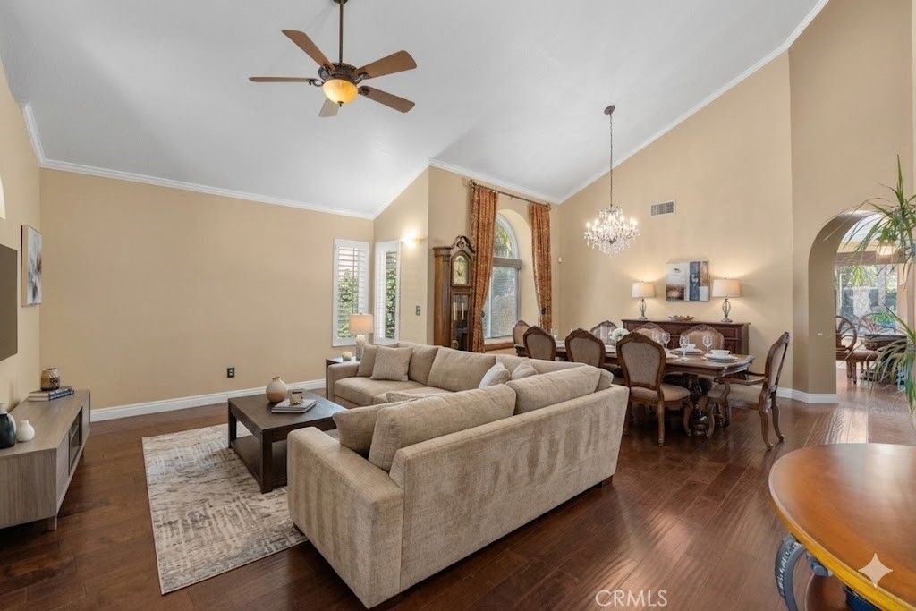 20344 Calhaven Drive Saugus, CA 91390 - Photo 16 of 70 a living room with furniture wooden floor and a chandelier