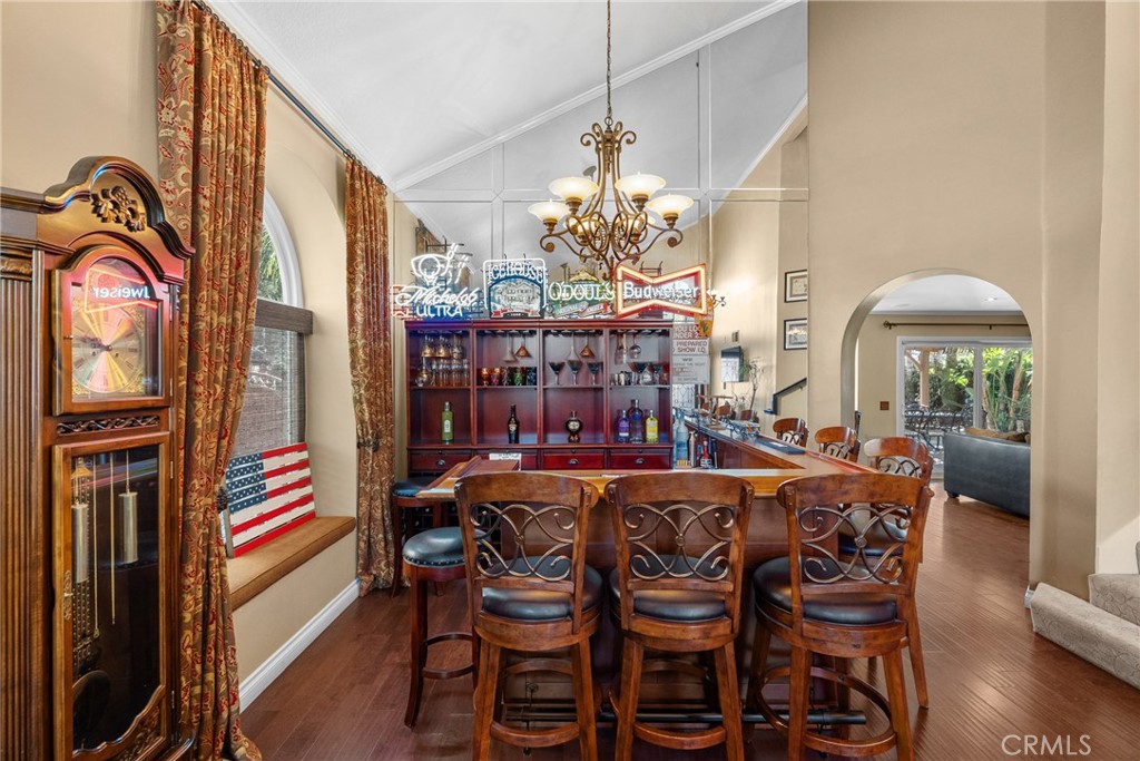 20344 Calhaven Drive Saugus, CA 91390 - Photo 21 of 70 a dining room with furniture a chandelier and wooden floor