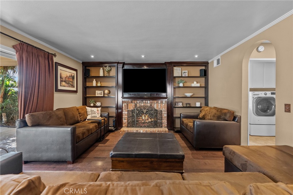 20344 Calhaven Drive Saugus, CA 91390 - Photo 31 of 70 a living room with furniture and a flat screen tv