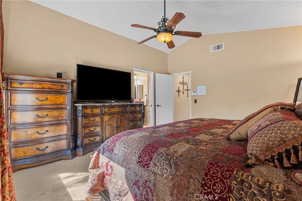 20344 Calhaven Drive Saugus, CA 91390 - Photo 43 of 70 a bedroom with a bed and a flat screen tv