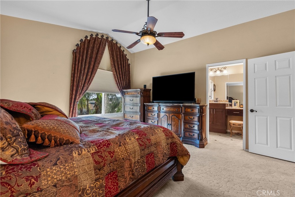 20344 Calhaven Drive Saugus, CA 91390 - Photo 44 of 70 a bedroom with a bed and a flat screen tv