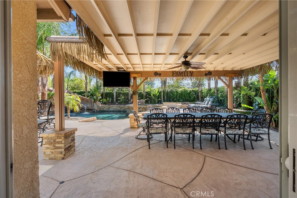 20344 Calhaven Drive Saugus, CA 91390 - Photo 49 of 70 a view of a patio with a table and chairs under an umbrella