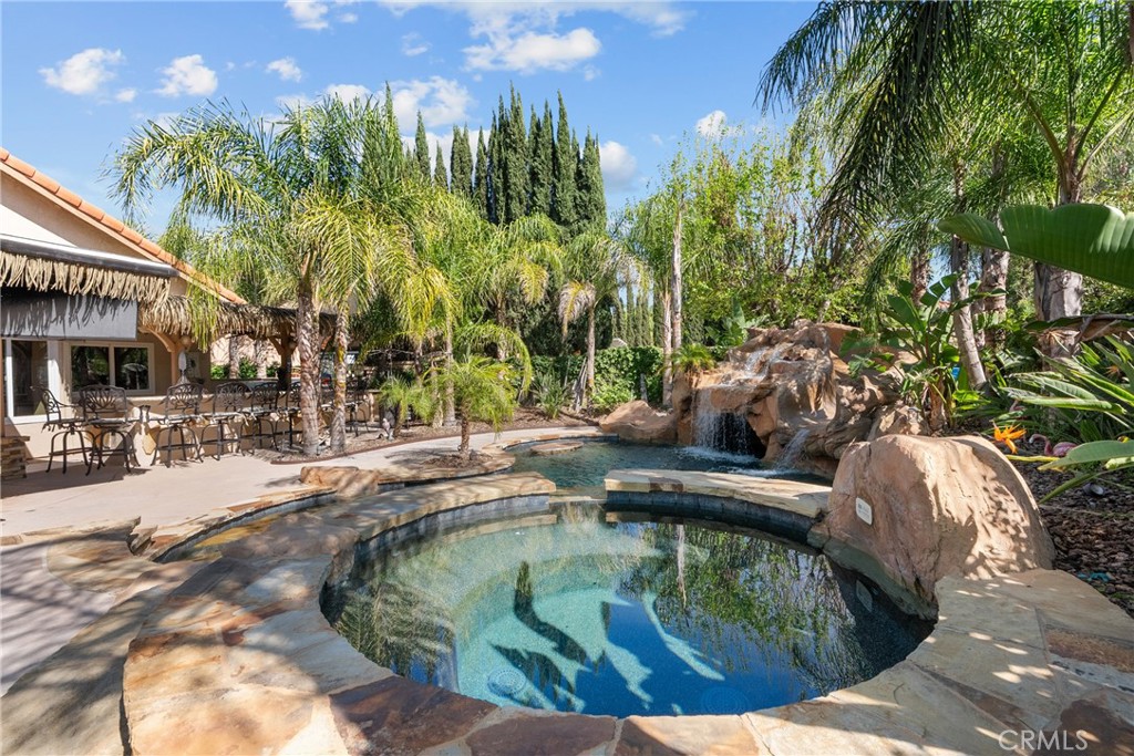20344 Calhaven Drive Saugus, CA 91390 - Photo 64 of 70 a view of a swimming pool with a patio and plants