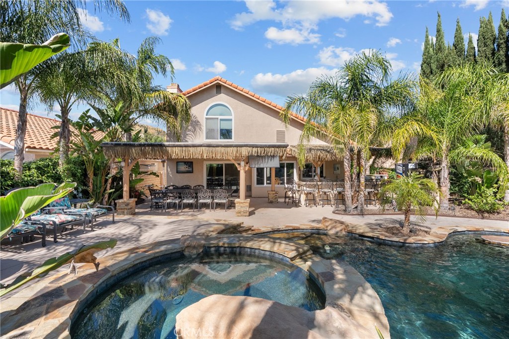 20344 Calhaven Drive Saugus, CA 91390 - Photo 65 of 70 a swimming pool view with a seating space and a garden