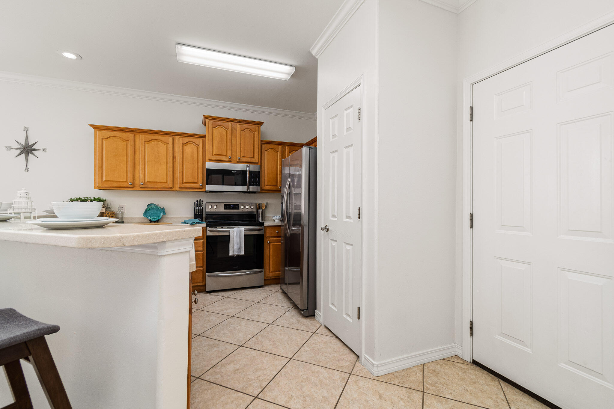 227 Inverrary Drive Destin, FL 32541 - Photo 13 of 50 a kitchen with a refrigerator stove and microwave