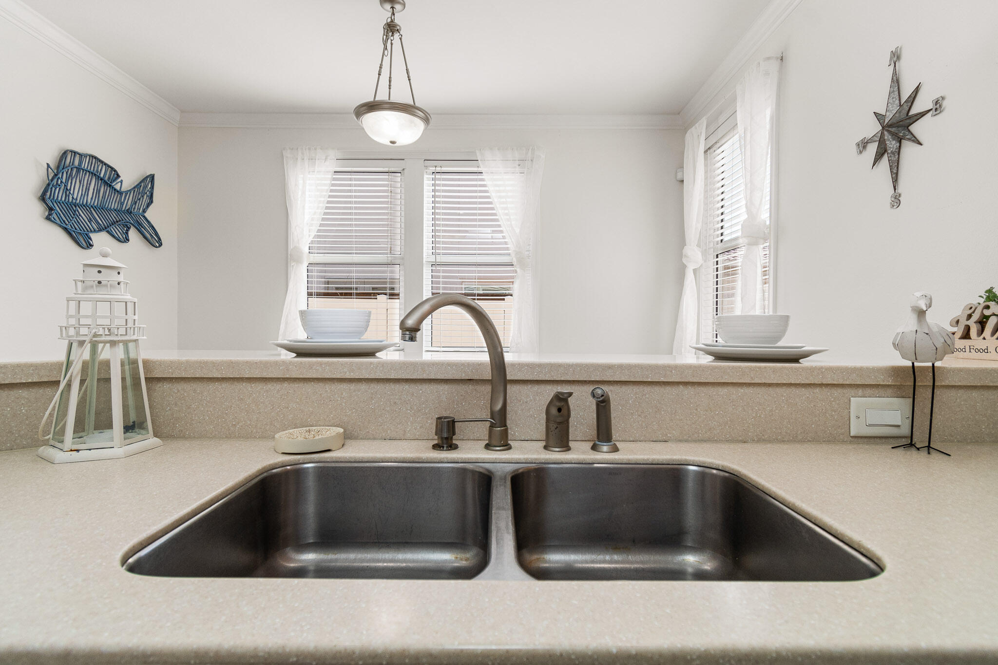 227 Inverrary Drive Destin, FL 32541 - Photo 16 of 50 a kitchen with a sink and a window