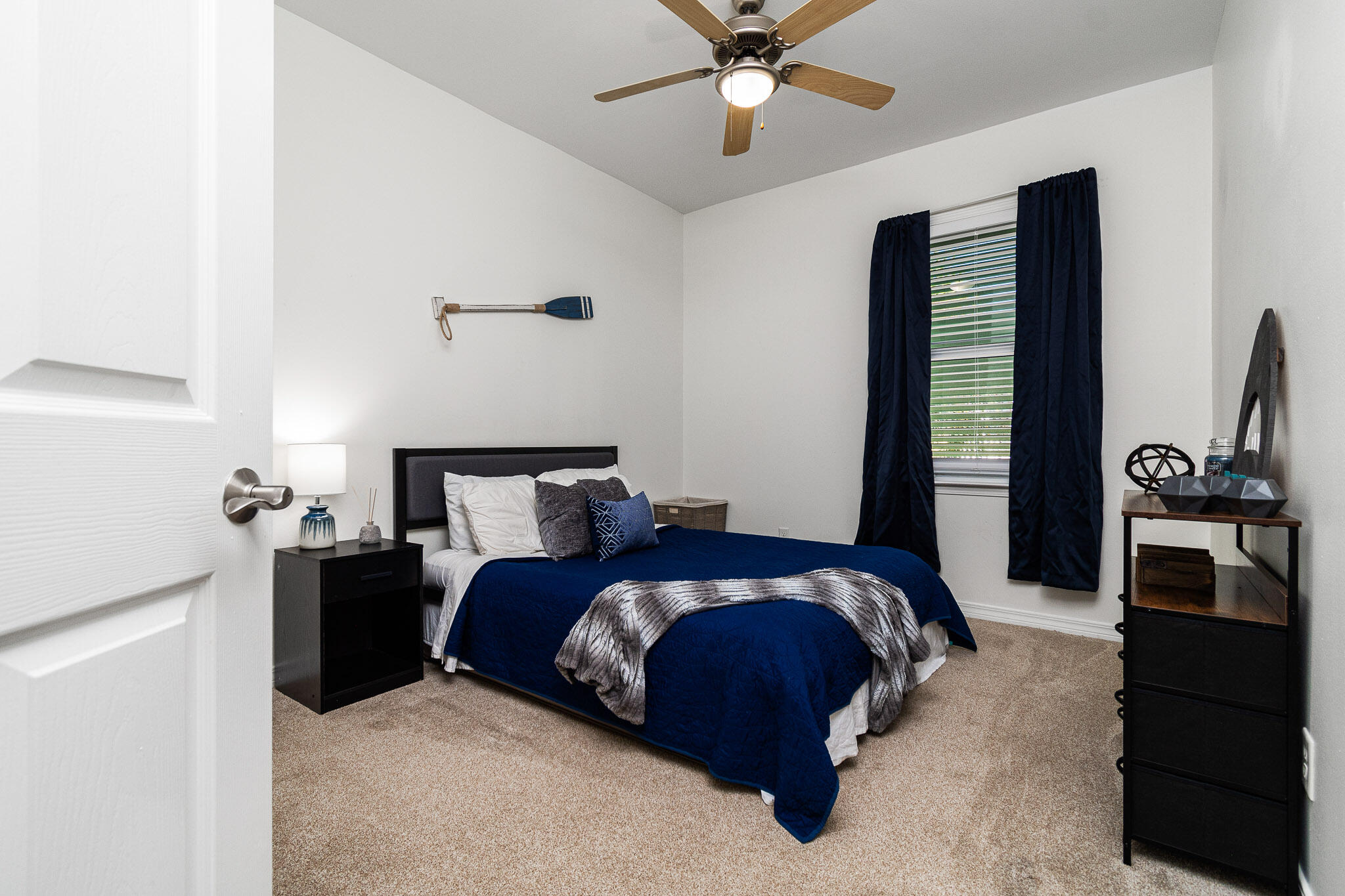 227 Inverrary Drive Destin, FL 32541 - Photo 28 of 50 a bedroom with a bed and a flat tv screen
