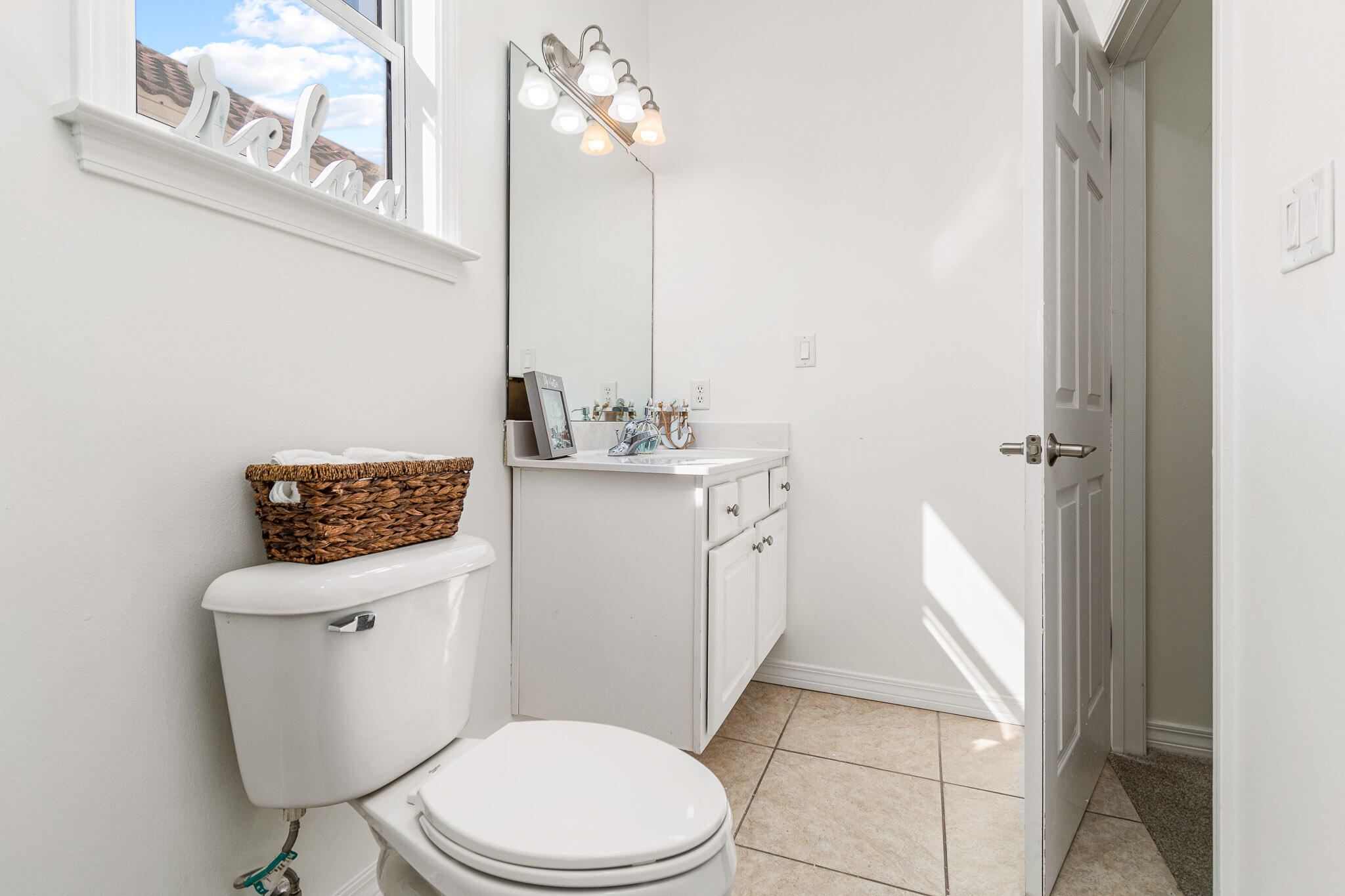 227 Inverrary Drive Destin, FL 32541 - Photo 32 of 50 a white toilet sitting next to a bathroom sink