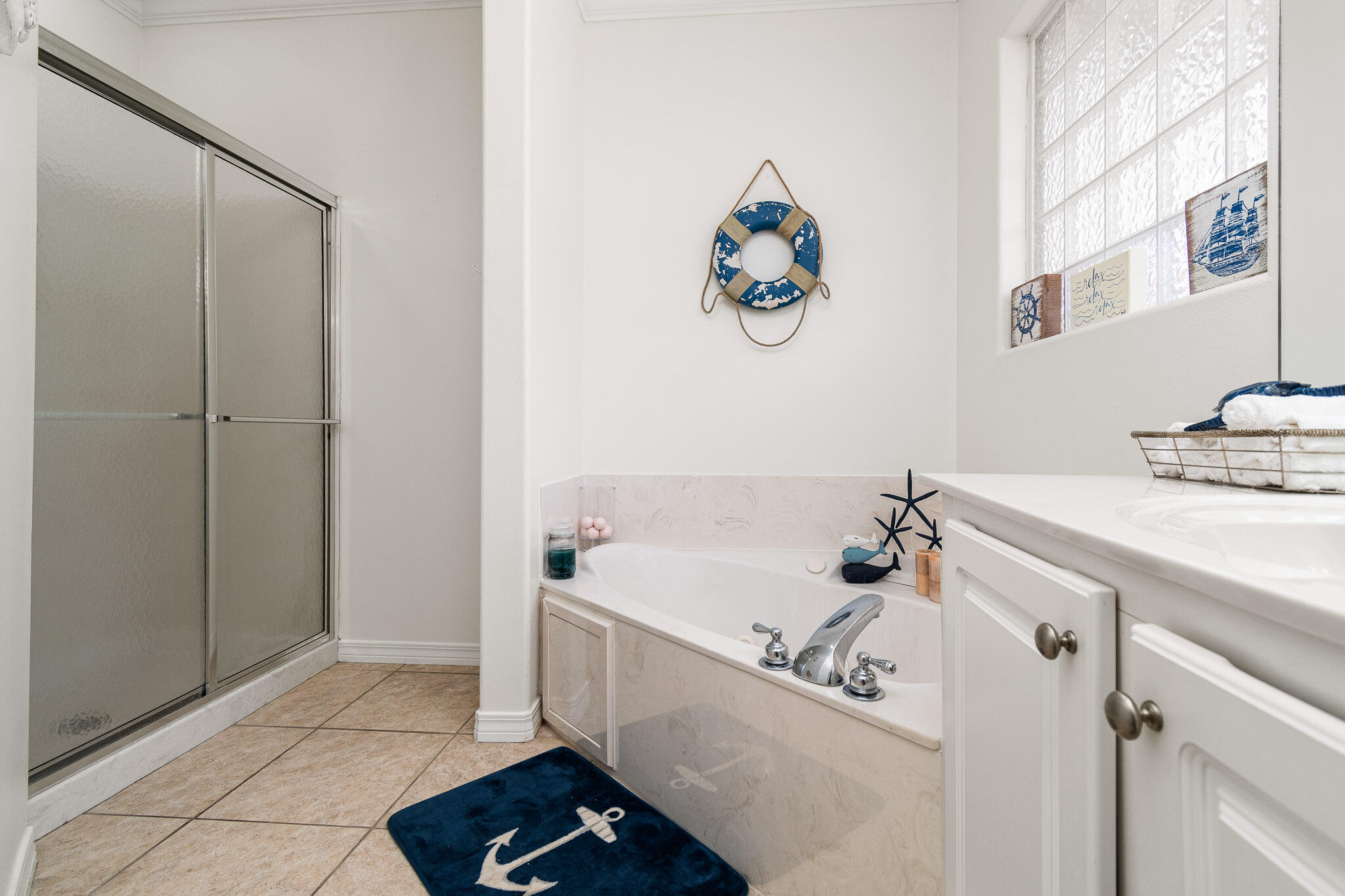 227 Inverrary Drive Destin, FL 32541 - Photo 35 of 50 a bathroom with a bathtub and a sink