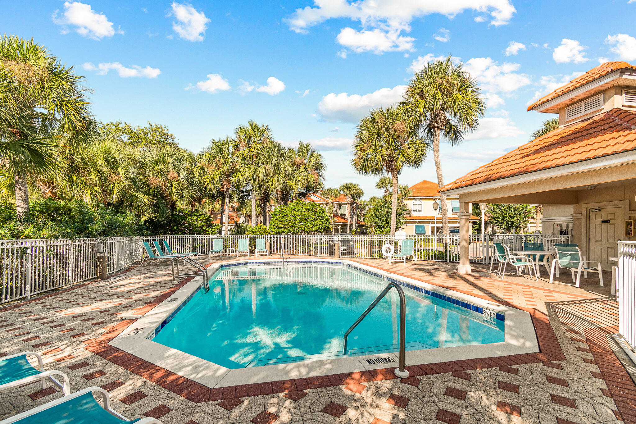227 Inverrary Drive Destin, FL 32541 - Photo 47 of 50 a view of a swimming pool with a lounge chairs