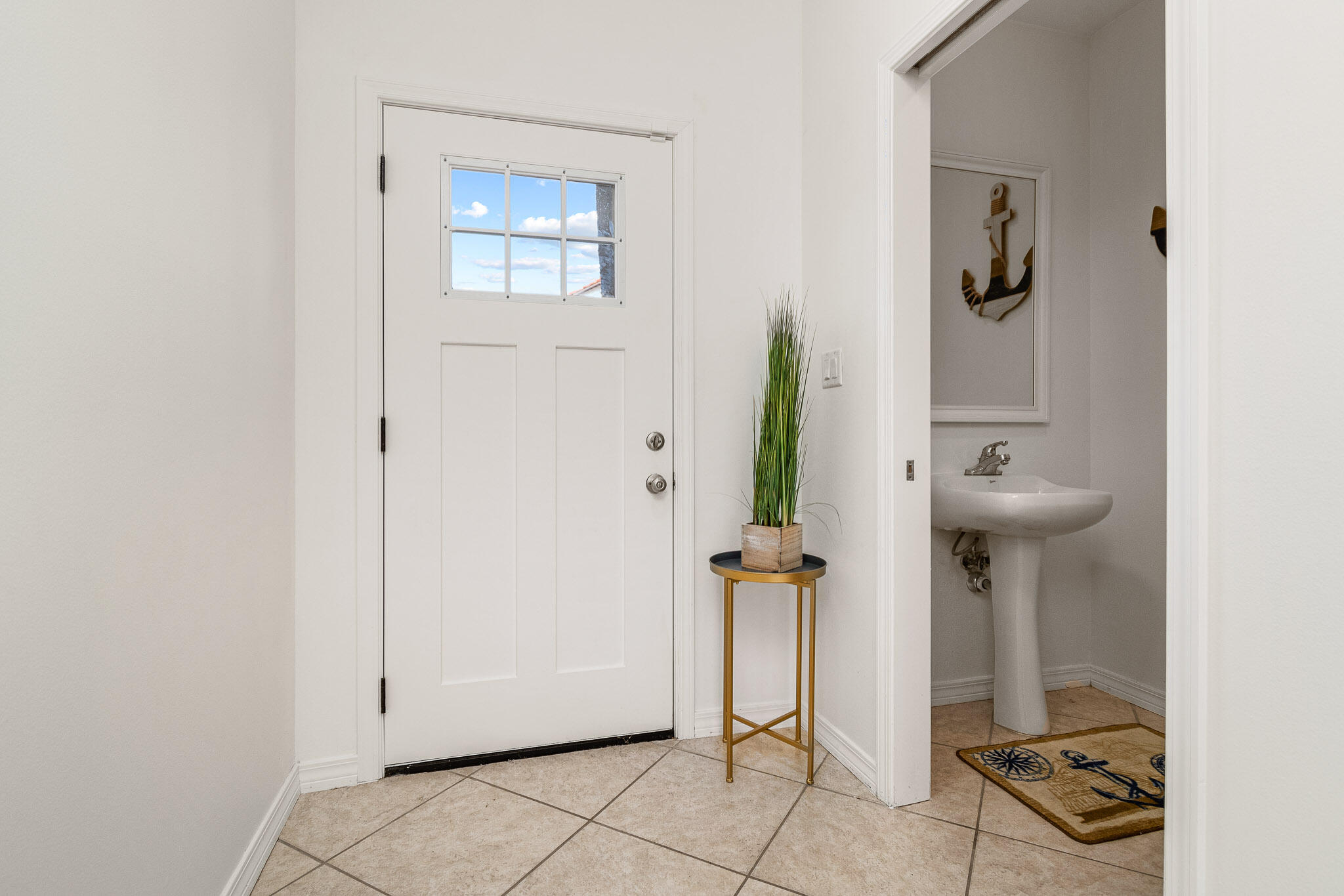 227 Inverrary Drive Destin, FL 32541 - Photo 6 of 50 a bathroom with a sink and a mirror