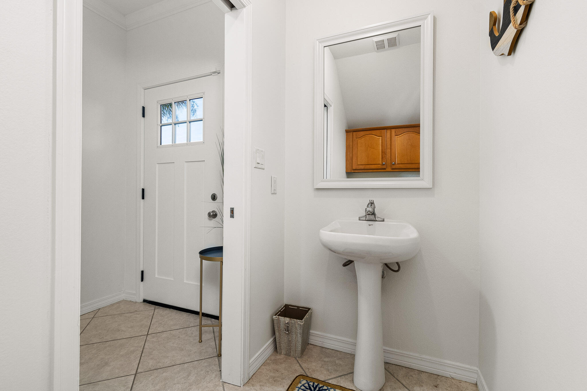 227 Inverrary Drive Destin, FL 32541 - Photo 8 of 50 a bathroom with a sink and a mirror