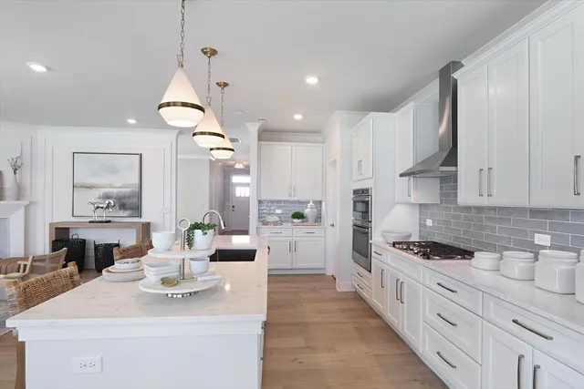 a kitchen with counter top space appliances and cabinets