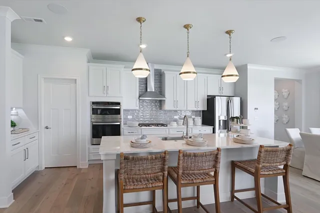 a dining room with furniture and wooden floor