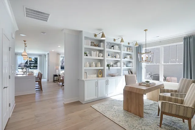 a view of a dining room with furniture window and wooden floor