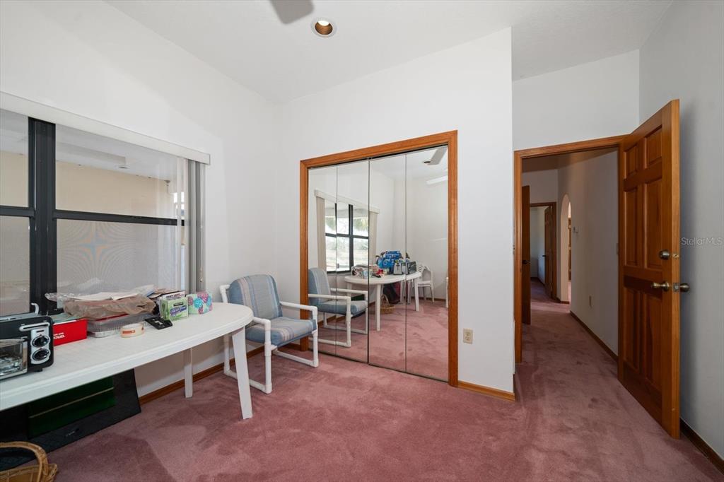 18419 Tyler Road Odessa, FL 33556 - Photo 22 of 38 a view of a livingroom with workspace and a window
