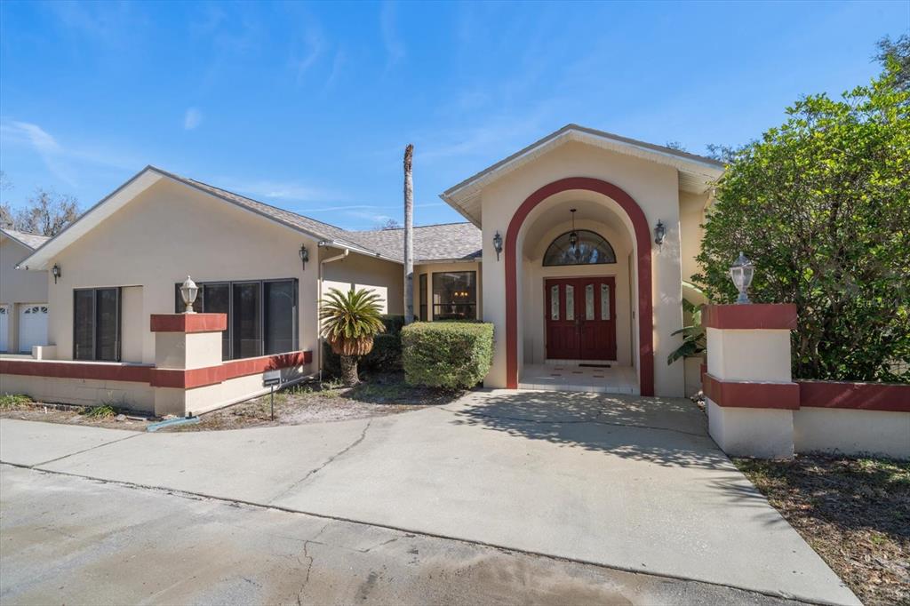 18419 Tyler Road Odessa, FL 33556 - Photo 3 of 38 a view of a house with outdoor space and porch