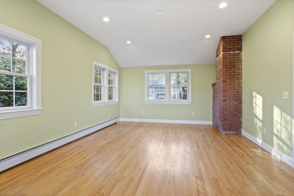88 Wright Road Concord, MA 01742 - Photo 12 of 42 a view of an empty room with a window and wooden floor