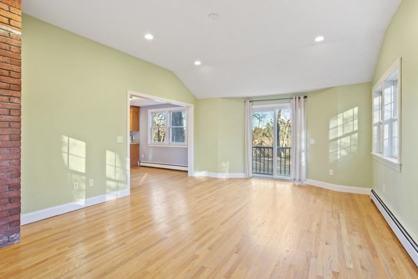 88 Wright Road Concord, MA 01742 - Photo 13 of 42 a view of an empty room with wooden floor and a window