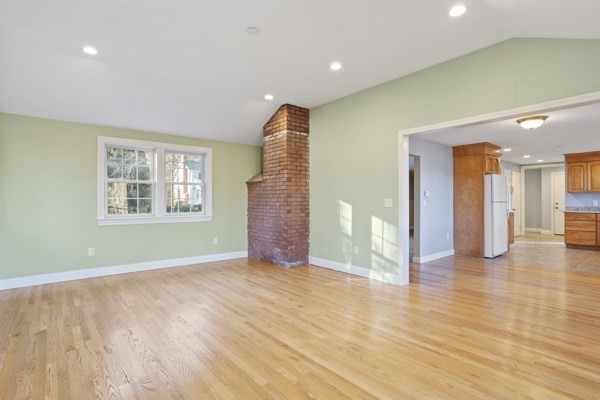 88 Wright Road Concord, MA 01742 - Photo 14 of 42 a view of an empty room with window and wooden floor