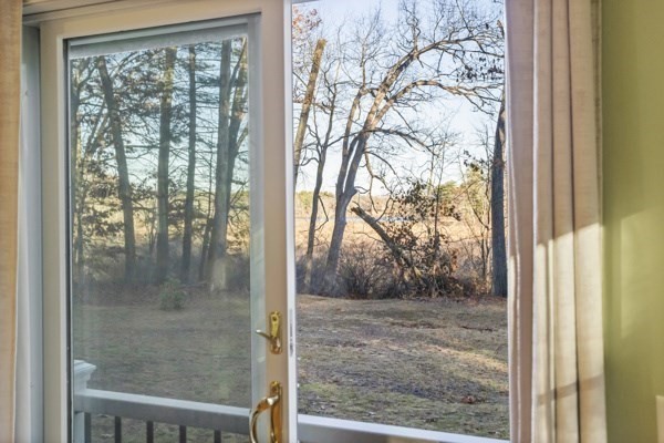 88 Wright Road Concord, MA 01742 - Photo 17 of 42 a view of a glass door and a window